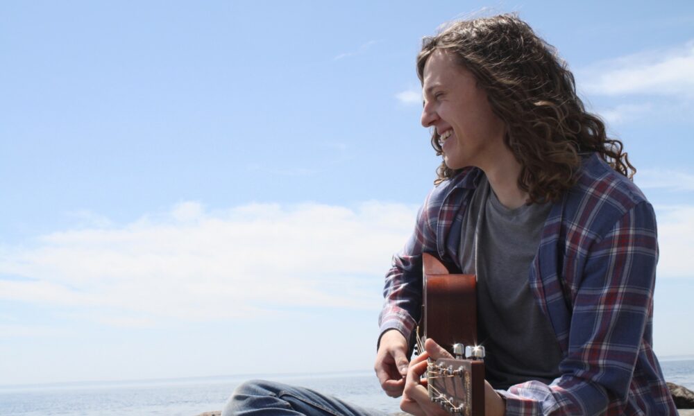 thumbnail_Ethan Todd smiling looking to the side lake superior